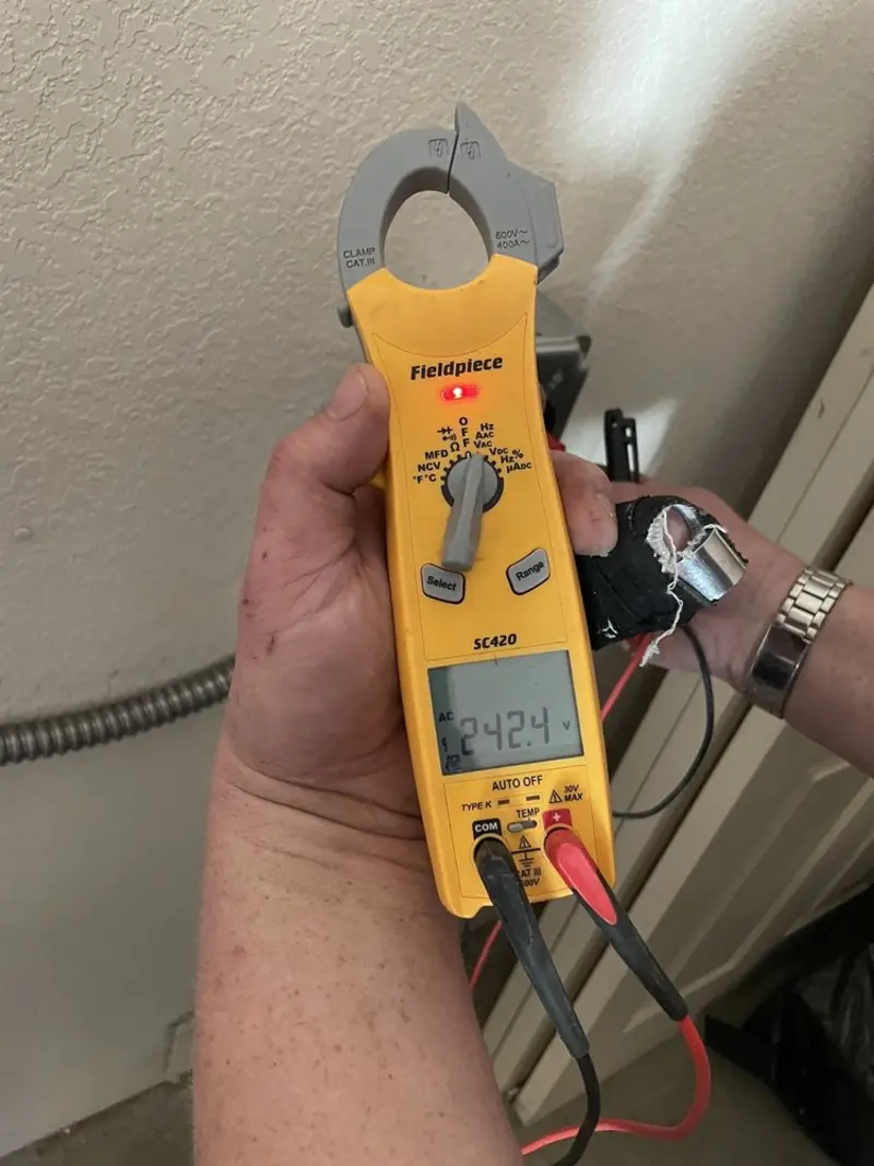 Voltage testing with clamp meter during Outlet Installation in Caernarvon